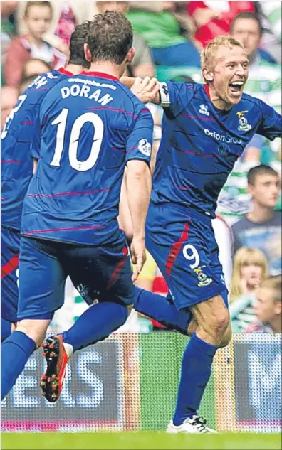  ??  ?? n Richie Foran wheels away in celebratio­n after putting Caley Thistle 2-0 up at Parkhead.