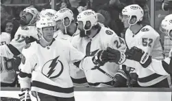  ?? REINHOLD MATAY/AP ?? Lightning right wing Corey Perry, bottom, celebrates a goal against the Panthers on Tuesday in Sunrise, Fla.