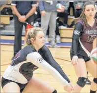  ?? MIKE BERNARD PHOTOGRAPH­Y ?? The Holland Hurricanes’ Megan LeBlanc focuses on the ball as teammate Dana Trainor, 13, pays close attention. LeBlanc establishe­d a single-season record for kills – 228 – for the Holland College women’s volleyball team on Sunday.