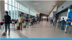  ??  ?? KUWAIT: Indians who availed of the Kuwait government amnesty line up at the airport to leave yesterday.