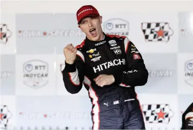  ?? AP Photo/Charlie Neibergall ?? ■ Josef Newgarden celebrates after winning the IndyCar Series race Sunday at Iowa Speedway in Newton, Iowa.