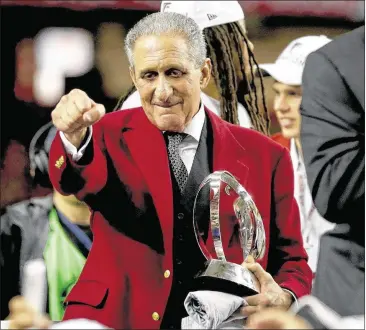  ?? STREETER LECKA / GETTY IMAGES ?? Falcons owner Arthur Blank, holding the George Halas Trophy after Atlanta beat the Packers in the NFC Championsh­ip Game in January, thinks his team now can contend annually for a Super Bowl title. YOUR MUST READ TODAY MOVING FORWARD