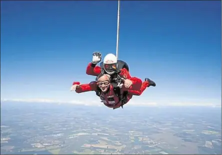  ?? ?? John Hibbert in his charity tandem skydive with The Red Devils