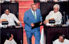  ??  ?? Finance Minister Mangala Samaraweer­a enters Parliament to deliver the Budget Speech.