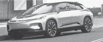  ?? PHOTOS BY FARADAY FUTURE ?? Faraday Future’s FF 91 EV will be built at a leased factory in Hanford, Calif., beginning sometime in 2018. There is no price yet for the 1,000- horsepower four- door vehicle.