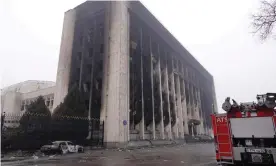  ?? ?? A burnt-out administra­tive building in central Almaty, after violence erupted following protests. Photograph: Abduaziz Madyarov/AFP/Getty Images