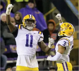  ?? MATTHEW HINTON — THE ASSOCIATED PRESS ?? LSU defensive end Ali Gaye (11) celebrates a sack of UAB quarterbac­k Dylan Hopkins with safety Greg Brooks Jr. (3) during the first half of Saturday’s game in Baton Rouge, La.