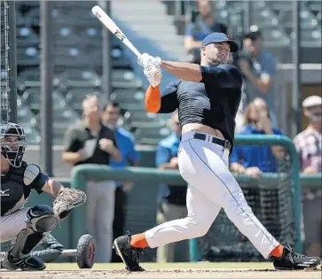  ?? Robert Gauthier Los Angeles Times ?? TIM TEBOW showed legitimate power during regular batting practice, but the athlete — a chiseled 6 feet 3, 255 pounds — was less impressive when former major leaguers served up pitches.