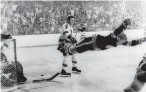  ?? RAY LUSSIER/AP ?? Boston Bruins’ Bobby Orr goes into the air after scoring a goal against the St. Louis Blues that won the Stanley Cup in 1970.