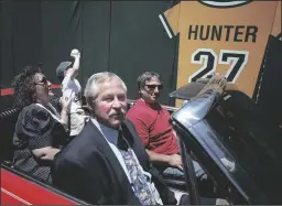  ?? LARRY STRONG/CONTRA COSTA TIMES ?? Jim “Catfish” Hunter, foreground, passes by his jersey number 27, hanging on the oufield wall at the Oakland Coliseum on Saturday, June 12, 1999. Hunter, who suffered from amyotrophi­c lateral sclerosis (ALS) Lou Gehrig’s disease, was honored before the Athletics’ game in Oakland, California., against the Los Angeles Dodgers. Hunter died in later that year.
