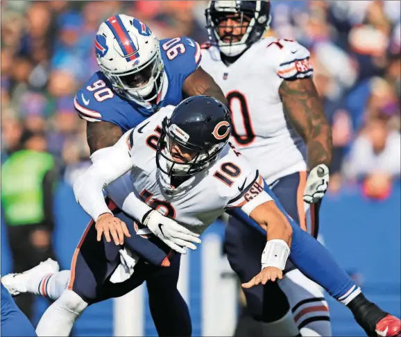  ?? [JEFFREY T. BARNES/THE ASSOCIATED PRESS] ?? Bills defensive end Shaq Lawson (90) hits Bears QB Mitchell Trubisky during the first half Sunday in Orchard Park, N.Y.