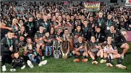  ?? GETTY IMAGES ?? The Penrith Panthers celebrate with the NRL trophy after their 28-12 win over the Parramatta Eels on Sunday night.