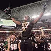  ?? AL DIAZ adiaz@miamiheral­d.com ?? Jonathan Garvin and the Hurricanes have their turnover chain. North Carolina has its version, a turnover belt.