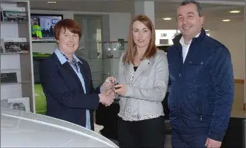  ??  ?? Tracey Lee Lis Na Dara winner of a VW Golf in the Dundalk Credit Union Car draw receiving her keys from Elizabeth Loughran, Dundalk Credit Union with Mark Conlon of Gerry Cumiskey Main VW Dealer.