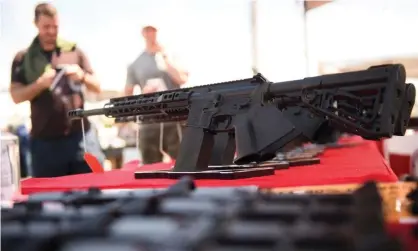  ?? Photograph: Patrick T Fallon/AFP/Getty Images ?? An AR-15-style rifle is displayed for sale at a gun show on 5 June 2021 in Costa Mesa, California.