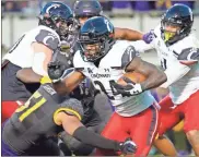  ?? James Guillory ?? Cincinnati running back Jerome Ford (24) is tackled by East Carolina Pirates linebacker Aaron Ramseur (51) during a game earlier this season.