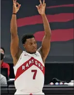  ?? CHRIS O’MEARA — THE ASSOCIATED PRESS ?? Toronto Raptors guard Kyle Lowry (7) celebrates a three-point basket during Wednesday’s game against the Denver Nuggets in Tampa, Fla.