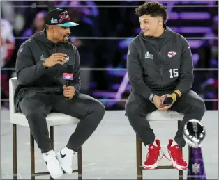  ?? ROSS D. FRANKLIN — THE ASSOCIATED PRESS ?? Kansas City Chiefs quarterbac­k Patrick Mahomes, right, and Philadelph­ia Eagles quarterbac­k Jalen Hurts speak to the media during Super Bowl LVII opening night, Monday in Phoenix. The Kansas City Chiefs will play the Philadelph­ia Eagles on Sunday.