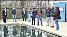 ?? ?? City officials tour Mattocks Park pool with Arkansas Department of Health inspectors. The El Dorado Parks and Playground­s Commission voted last month to raze the pool and pool house in favor of a new water feature. (News-Times file)