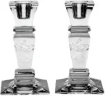  ??  ?? “Catherine” candlestic­ks by William Yeoward Crystal, $190 (set of 2); Gearys
