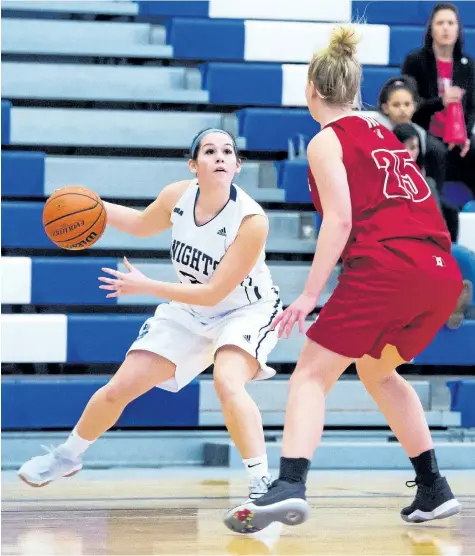  ?? RYAN MCCULLOUGH/ NIAGARA COLLEGE ?? Niagara's Mary Ingribelli, left, is defended by Redeemer in college women's basketball Saturday in Welland.