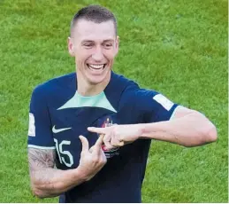  ?? Photo / AP ?? Mitch Duke signals to his son Jaxson in the crowd after scorring against Tunisia.