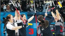  ?? APPHOTO ?? The South Korea women’s curling team celebrates after beating Japan in the semifinal on Feb. 23.