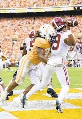  ?? AP ?? Jeremy Banks and Tennessee send Alabama tumbling to No. 6 in poll.