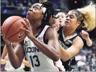  ?? Jessica Hill / Associated Press ?? UConn’s Christyn Williams, left, looks to shoot as Georgetown’s Kaylin West defends during their Big East Tournament quarterfin­al game Saturday at Mohegan Sun Arena in Uncasville.