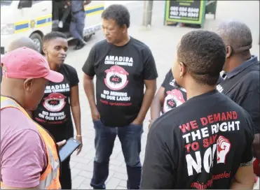  ?? PHOTO: JACQUES NAUDE/AFRICAN NEWS AGENCY/ANA ?? Amadiba Crisis Committee members and supporters outside the high court in Pretoria. Amadiba Crisis Committee is taking on the mineral resources department over the rights of communitie­s living in mining areas.