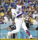  ?? The Associated Press ?? Raul Romero Jr.
Dodgers rookie Miguel Vargas belts his first major league home run Saturday in Los Angeles’ 6-2 victory over the Cardinals at Chavez Ravine.