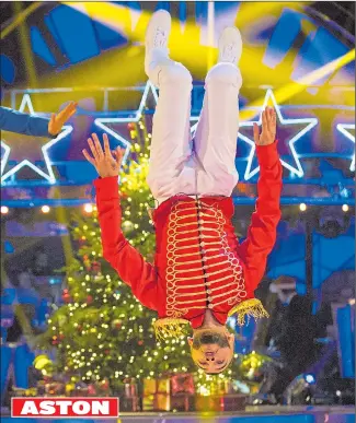  ??  ?? Caroline Flack as Pinocchio, left, and Aston Merrygold, top, an acrobatic Toy Soldier ASTON