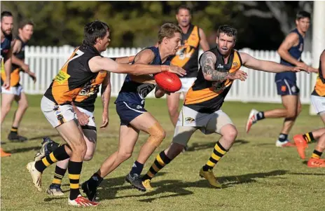  ??  ?? STRONG RUN: Zane Bausch makes ground for Coolaroo against Toowoomba Tigers in AFL Darling Downs round seven at Rockville Oval.