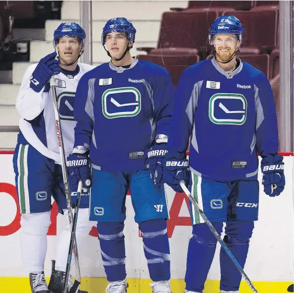  ?? MARK VAN MANEN/ PNG FILES ?? The Canucks may turn things around, but will Jannik Hansen, left, Alex Burrows or Daniel Sedin be around to see it?