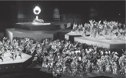  ??  ?? Performers in front of the Pan Am Games flame during the closing ceremony. REUTERS/Ivan Alvarado.