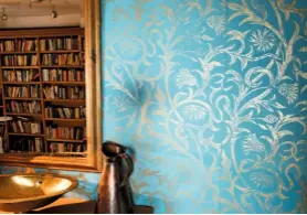  ??  ?? Hugh’s home is adorned with his wallpaper, whether chosen to complement a golden frame and bowl or hanging to dry in his studio.