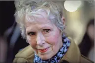  ?? Seth Wenig / Associated Press file photo ?? E. Jean Carroll talks to reporters outside a courthouse in New York. Lawyers for Carroll, who is suing former President Donald Trump, wrote the U.S. Justice Department made a “wrong and dangerous” argument in seeking to defend him in court papers filed late Friday.