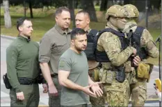  ?? AP photo ?? Ukrainian President Volodymyr Zelenskyy (center), reacts after his press conference in Kyiv, Ukraine on Friday.