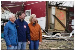  ?? (AP/Andrew Harnik) ?? Former Kentucky Gov. Steve Beshear (from left), Gov. Andy Beshear and his wife, Britainy Beshear, listen as President Joe Biden speak Wednesday after surveying storm damage from tornadoes and extreme weather in Dawson Springs, Ky..