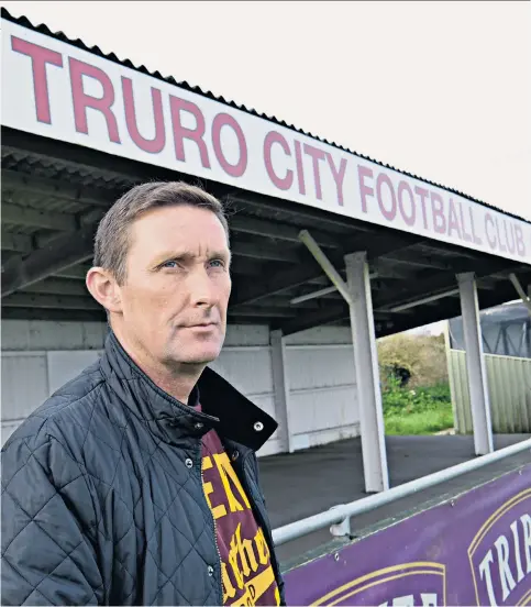  ??  ?? Cornish delight: Truro groundstaf­f at work (top); manager Lee Hodges (above); goalkeeper Tom McHale (below)