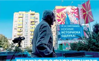  ??  ?? SKOPJE: A man leaves the polling station after casting his ballot for a referendum to re-name the country North Macedonia yesterday. —AFP