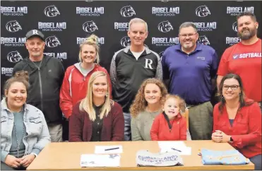  ?? Scott Herpst ?? On hand to watch Ridgeland senior Marianne Beliveau sign on to continue her softball career at the University of the Cumberland­s (Ky.) was UC assistant coach Alyssa Richards, UC head coach Bailey Dillender, Jojo Moore and Alicia Moore. On the back row are Ridgeland assistant coaches Wade Thomison and Keli Bruning, Ridgeland head coach Richie Wood, Roger Herold and Jimbo Moore.