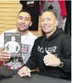  ??  ?? George Ferris, left, meets Canadian mixed martial arts legend Georges St-Pierre during a promotiona­l event in Calgary on Thursday.