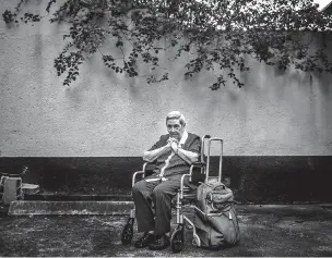  ?? MERIDITH KOHUT/THE NEW YORK TIMES ?? María Abad Cruz, who is on the cusp of her fourth migration, sits last month outside her home in Caracas, Venezuela. Amid the worsening economic and political crises, life has become too difficult and, with reluctance, she is coming to the realizatio­n...