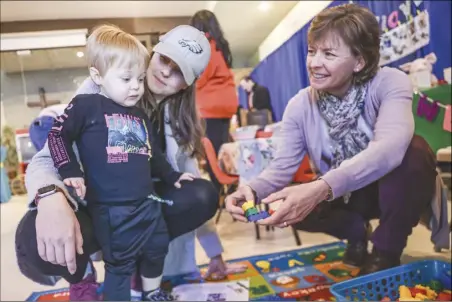  ?? Chris Torres/ The Signal ?? Lauren Ruff and her son, Everett, 2, play with Legos with Michelle Moyer, the director of Small World Preschool, during the annual My Preschool Fair held on Saturday at Santa Clarita United Methodist Church in Saugus.