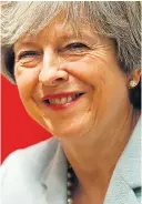  ??  ?? All smiles: Mrs May yesterday