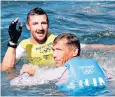  ??  ?? Giles Scott, left, celebrates winning gold alongside silver medallist Zsombor Berecz