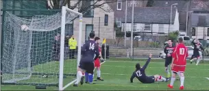  ??  ?? The ball is in the back of the Pupils’ net for Saints’ third goal, but who scored it – Craig MacEwan or Marc Maccallum? After lengthy deliberati­on the goal was eventually given to Maccallum.