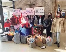  ?? Holy Trinity Catholic Academy / Contribute­d photo ?? The Holy Trinity Catholic Academy Student Council collected more than 50 coats during its annual coat drive.