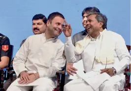  ?? — PTI ?? Congress vice-president Rahul Gandhi with Karnataka chief minister Siddaramai­ah at the launch of the commemorat­ive edition of National Herald in Bengaluru on Monday.